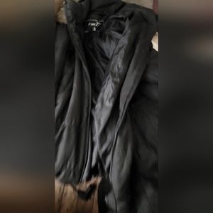 Women's coat has a broken zipper